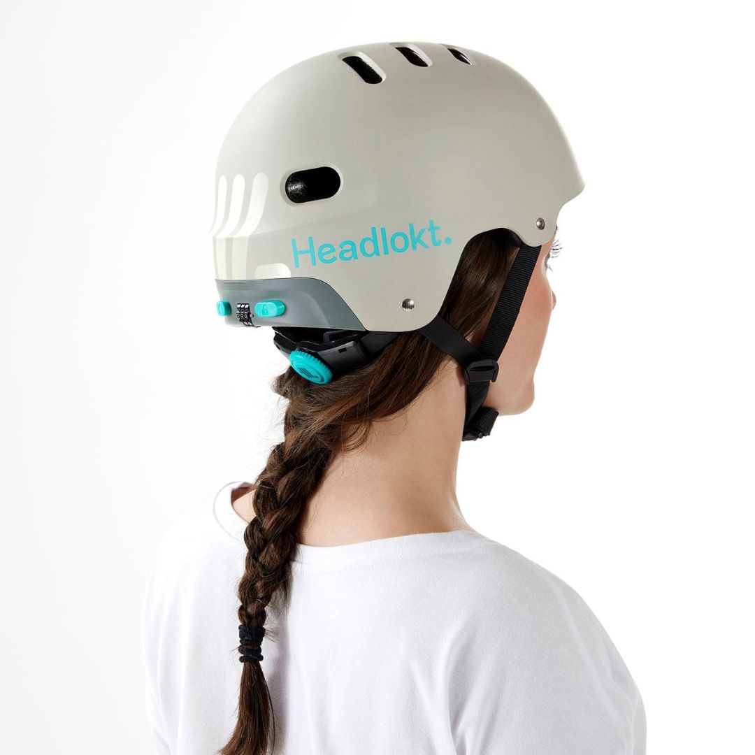 Woman wearing Headlokt white helmet back view